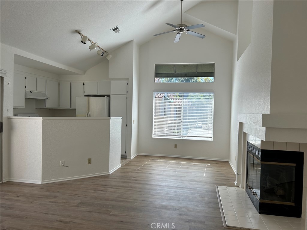 a view of a kitchen with furniture and a fireplace