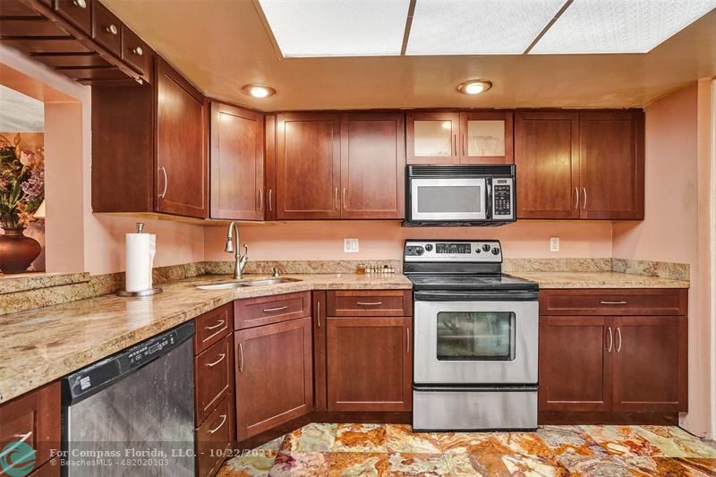 a kitchen with a stove and a sink