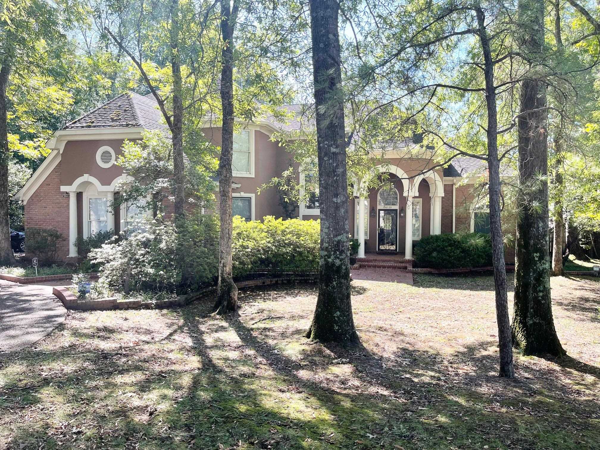 a house with trees in front of it