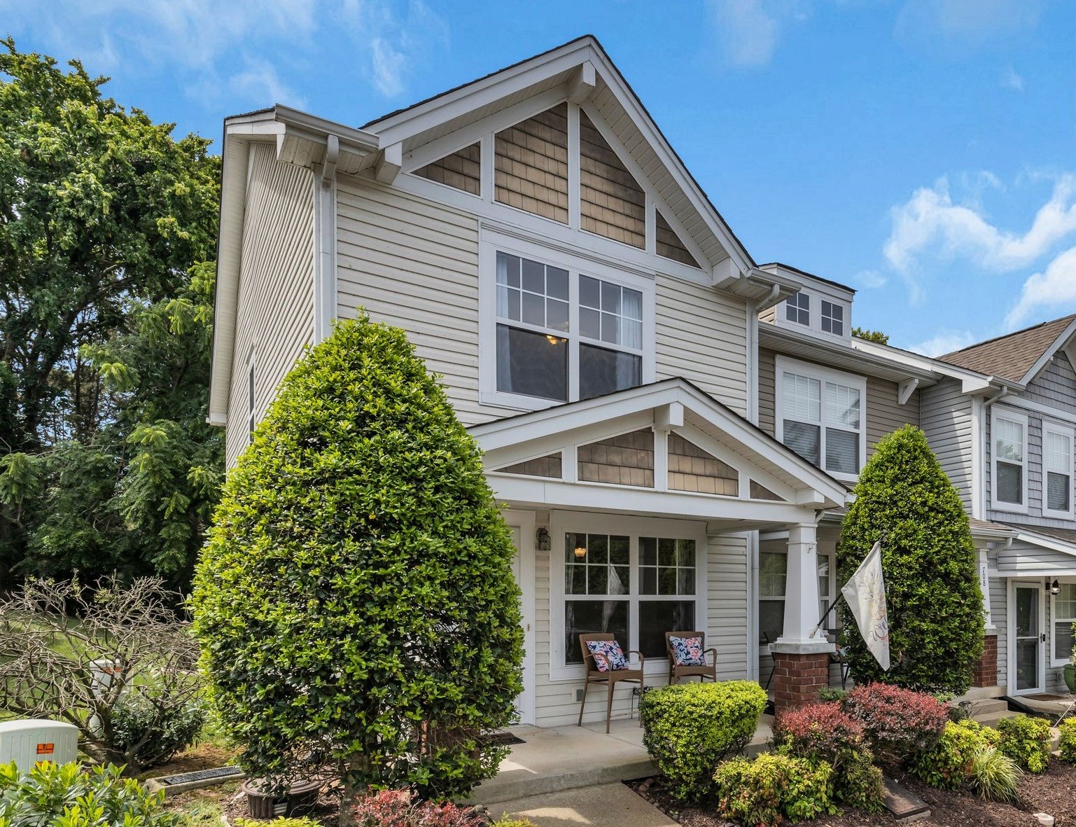 front view of a house with a garden