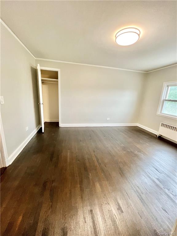 Living room dark hardwood / wood-style flooring, and ornamental molding