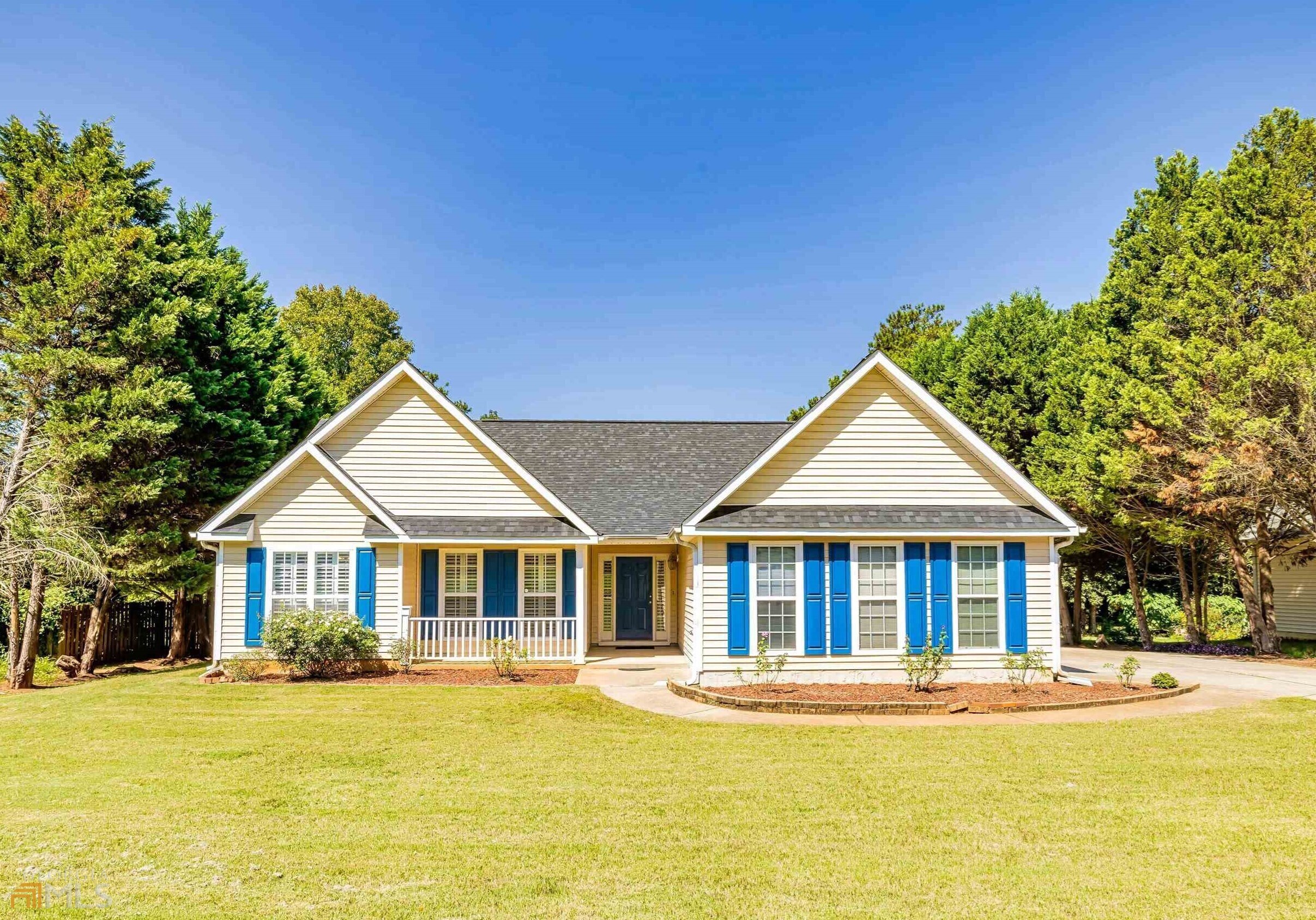 a front view of a house with a yard