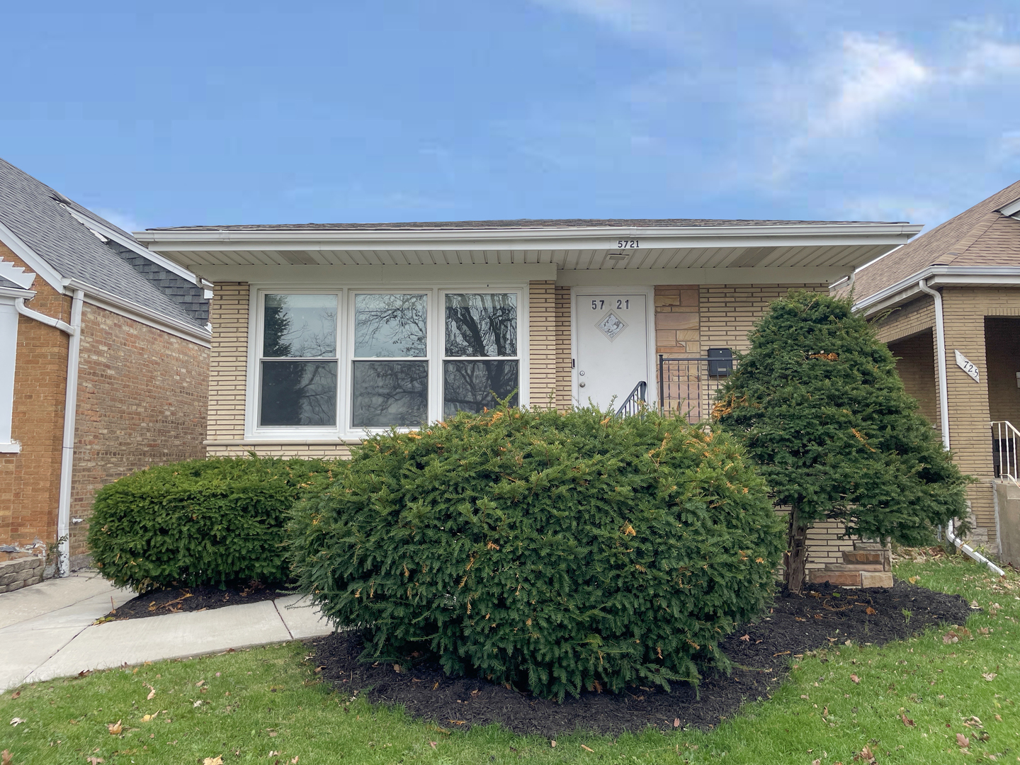 front view of a house with a yard