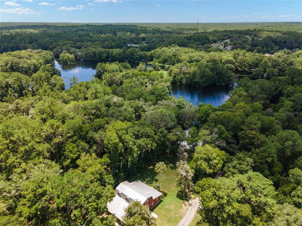 an aerial view of a house with yard