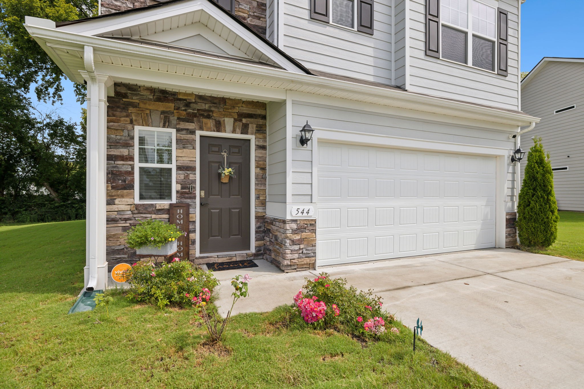 a front view of a house with a yard