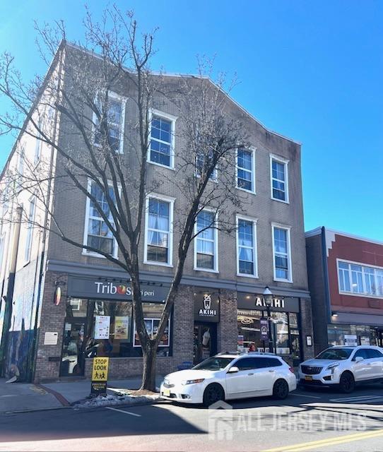 a front view of a building with street view