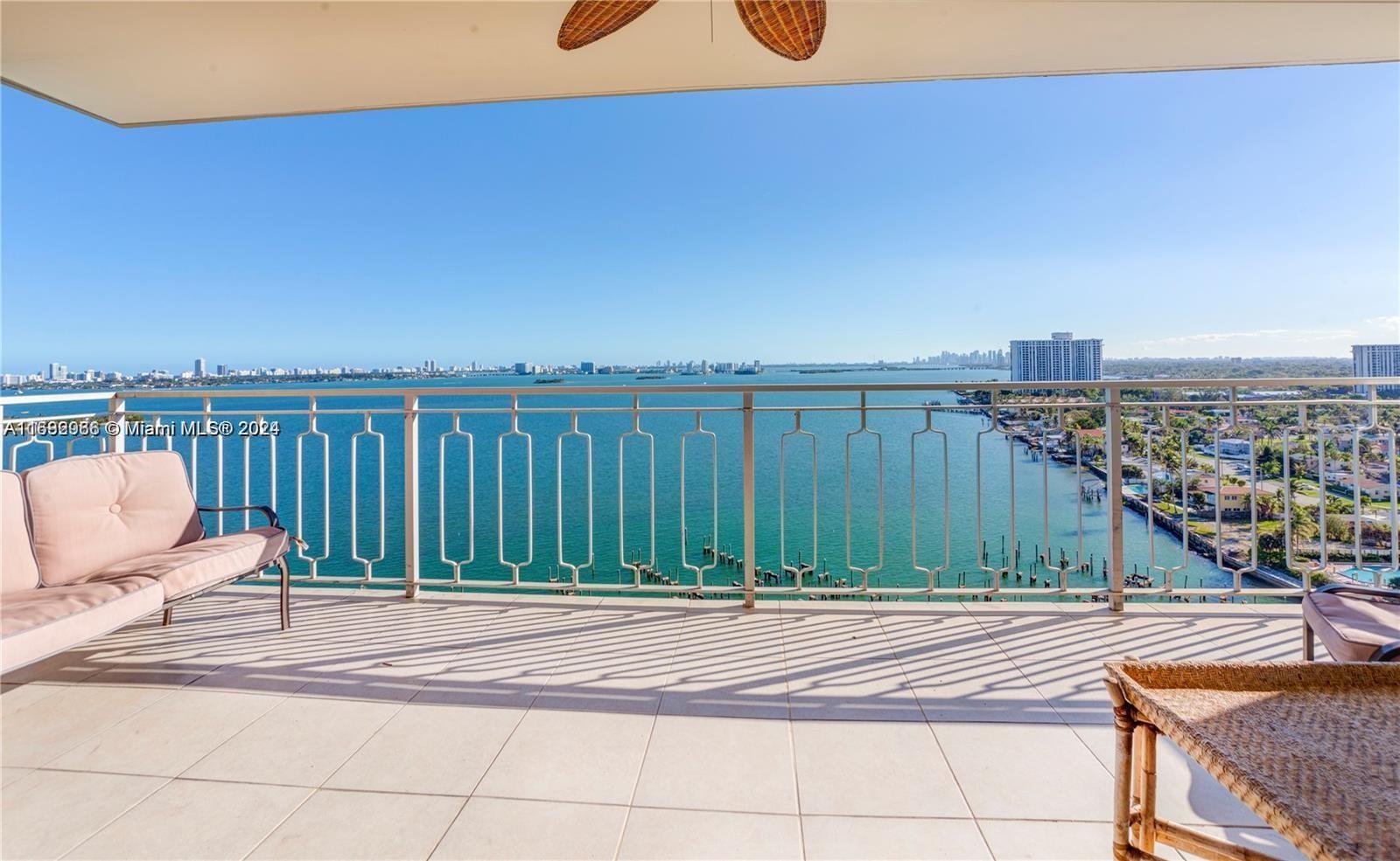 a view of a balcony with wooden floor