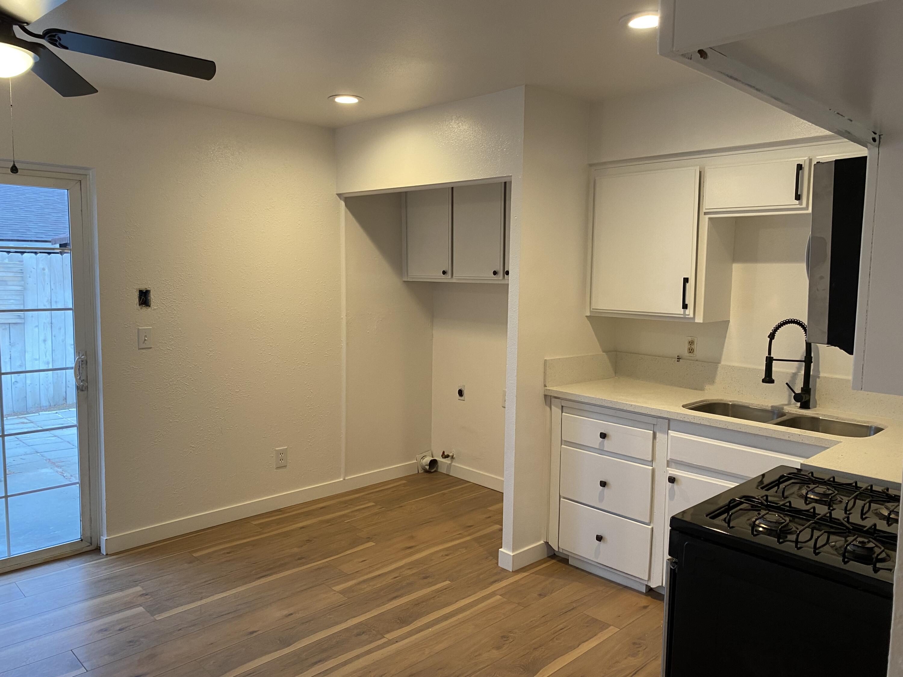 a kitchen with a sink and cabinets