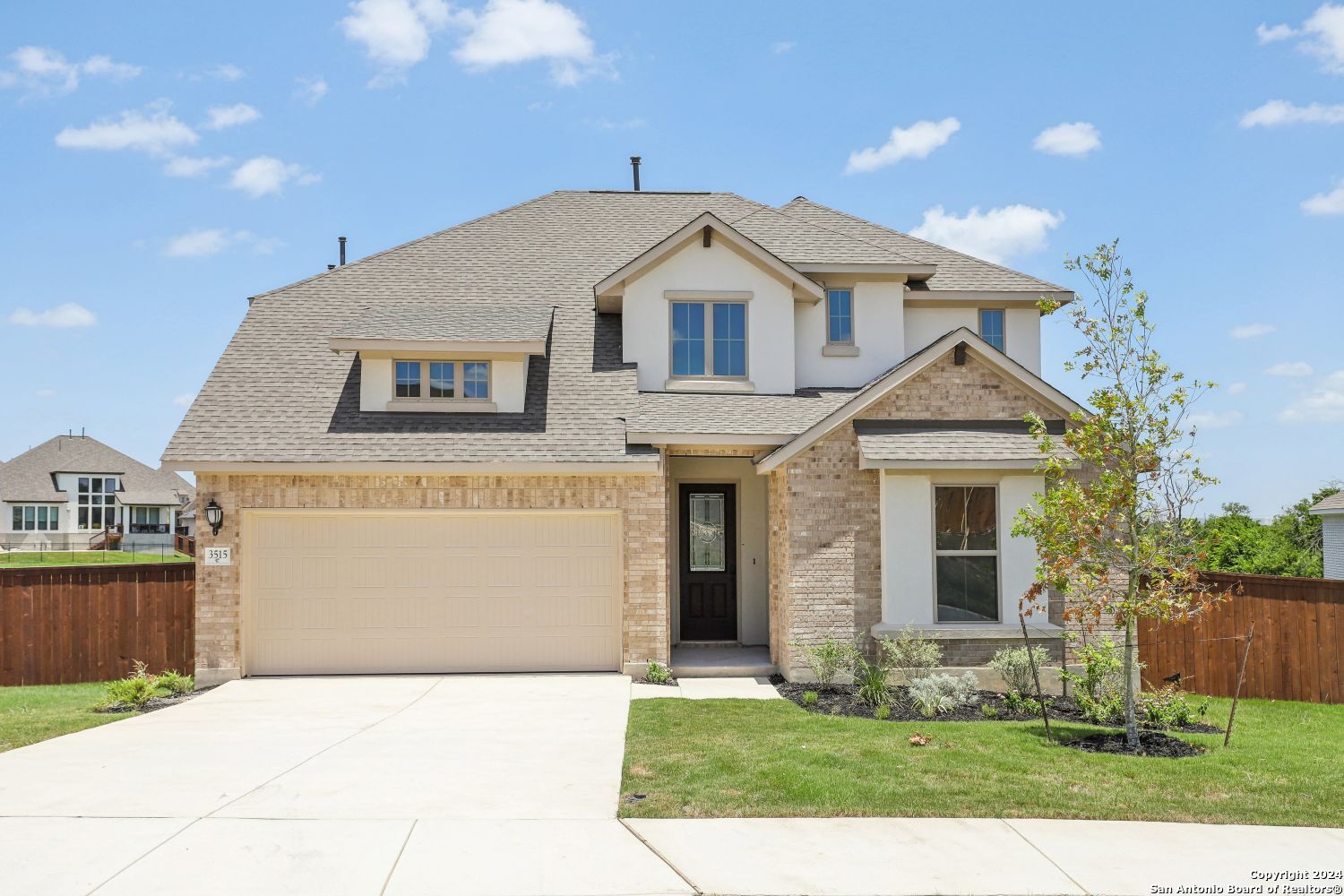 a front view of a house with yard