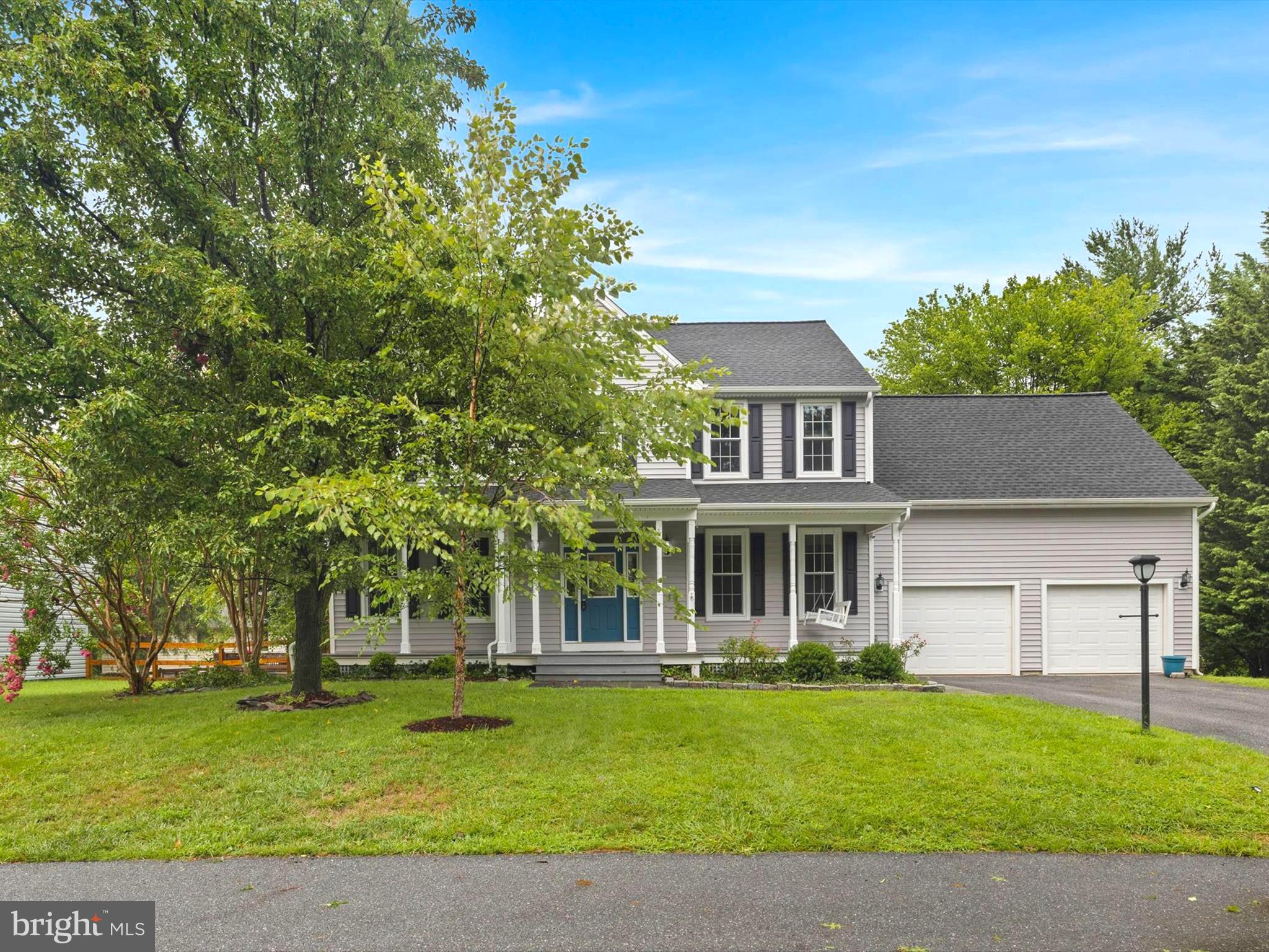 front view of a house with a garden