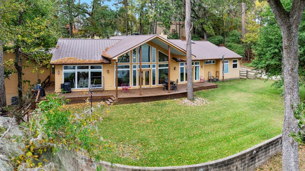 a view of a house with a yard porch and sitting area