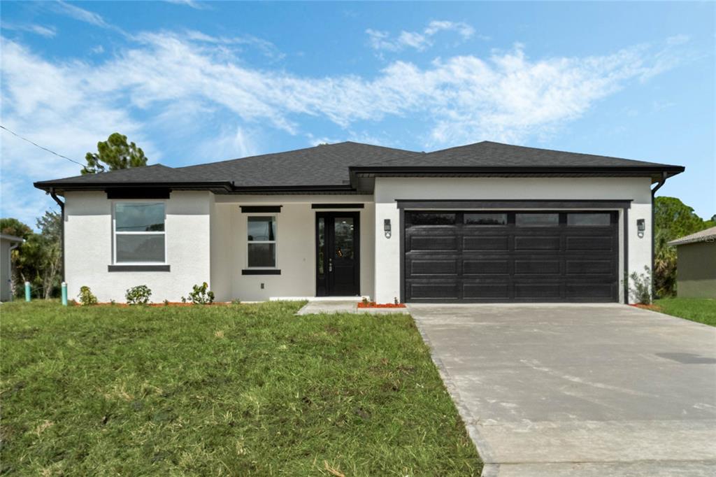 a front view of a house with yard