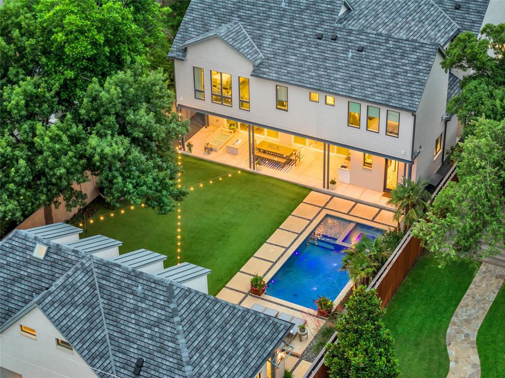 aerial view of a house with a yard