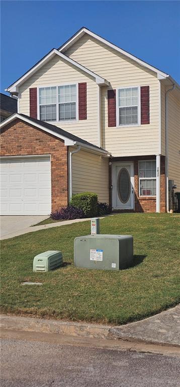 a front view of a house with a yard