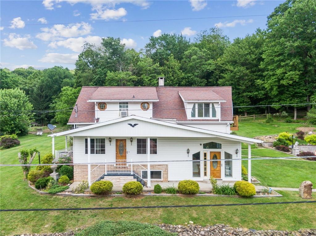 front view of a house with a yard