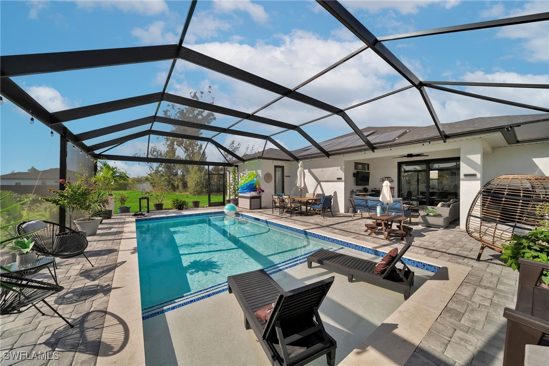 a view of a swimming pool with a patio