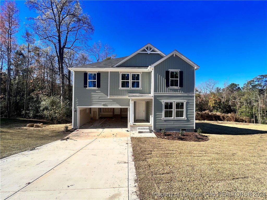 a front view of a house with yard