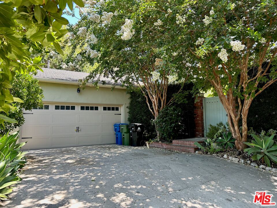 a view of a house with a tree