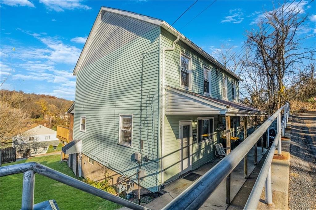 a view of house with outdoor seating