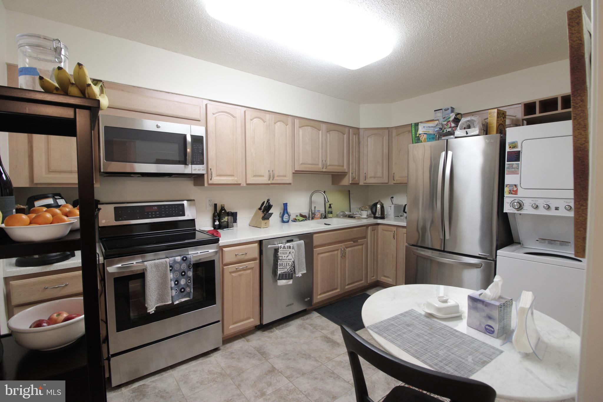 a kitchen with a sink stove and refrigerator