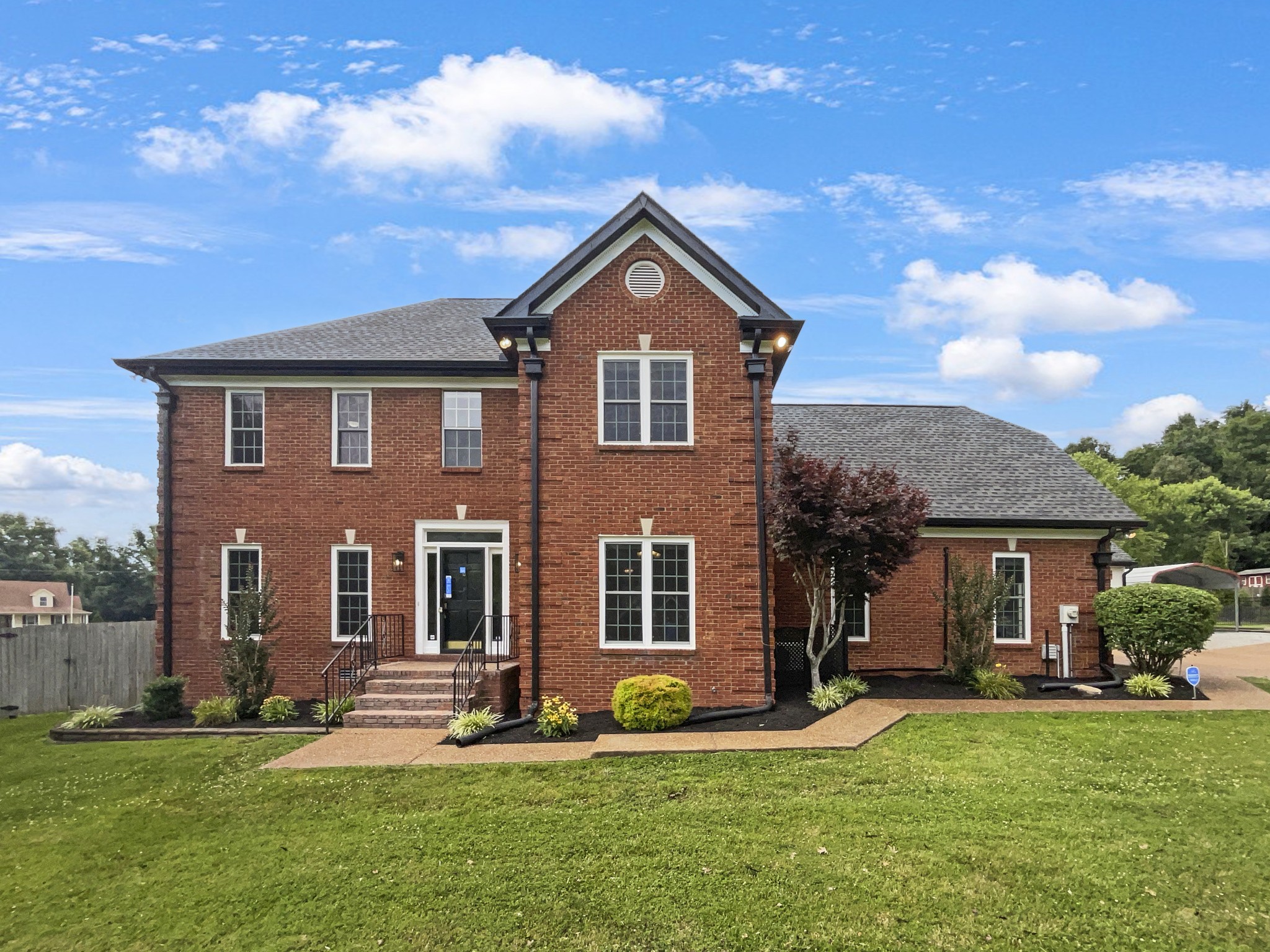 front view of a house with a yard