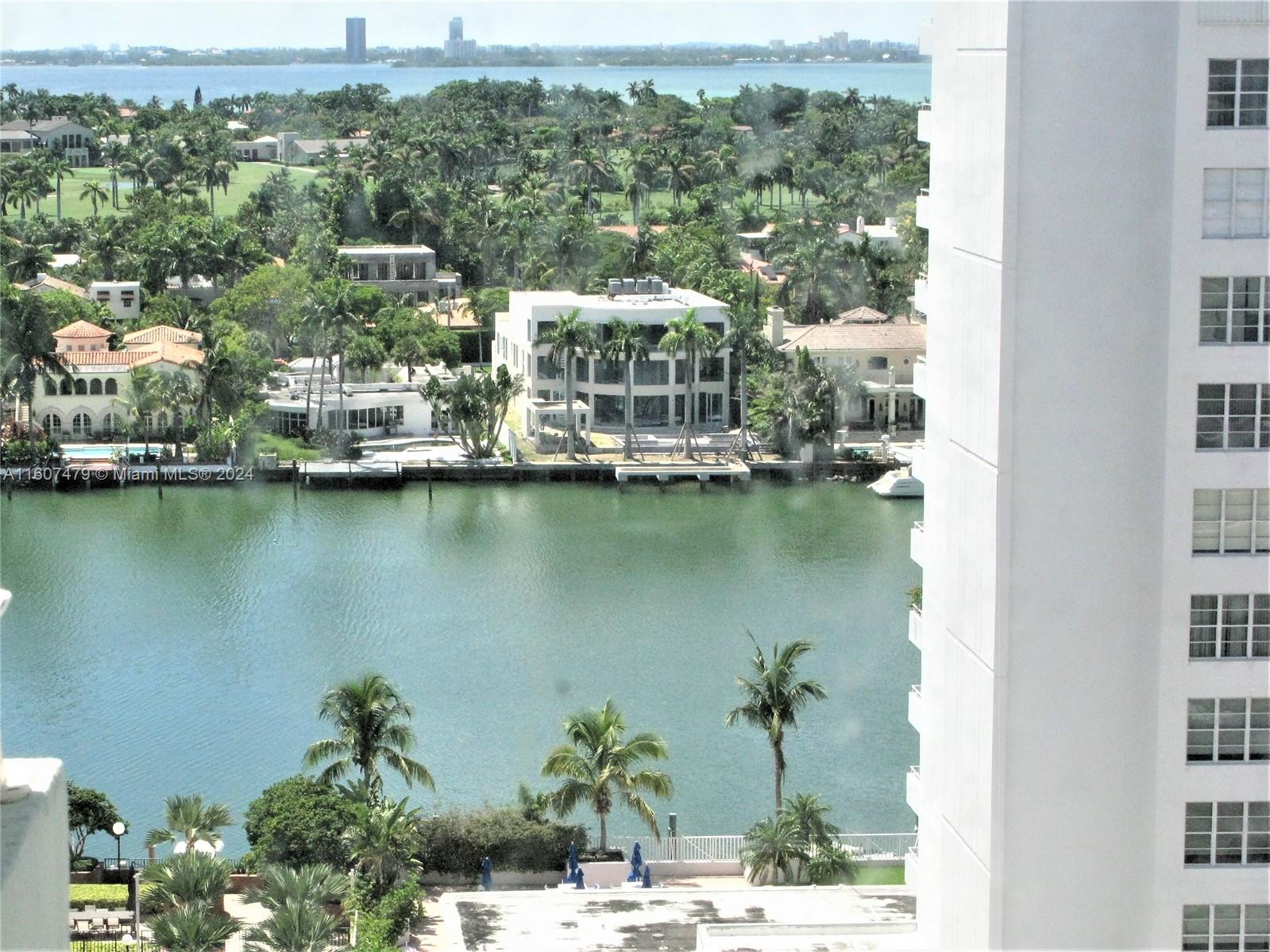 an aerial view of a house with a lake view