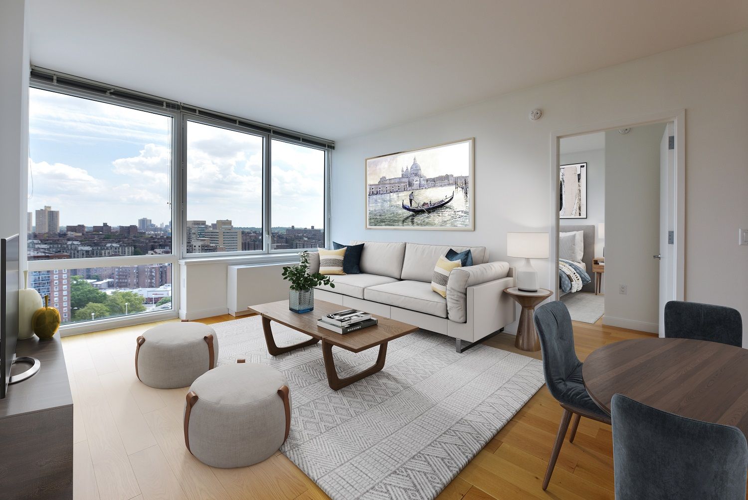 a living room with furniture and a floor to ceiling window