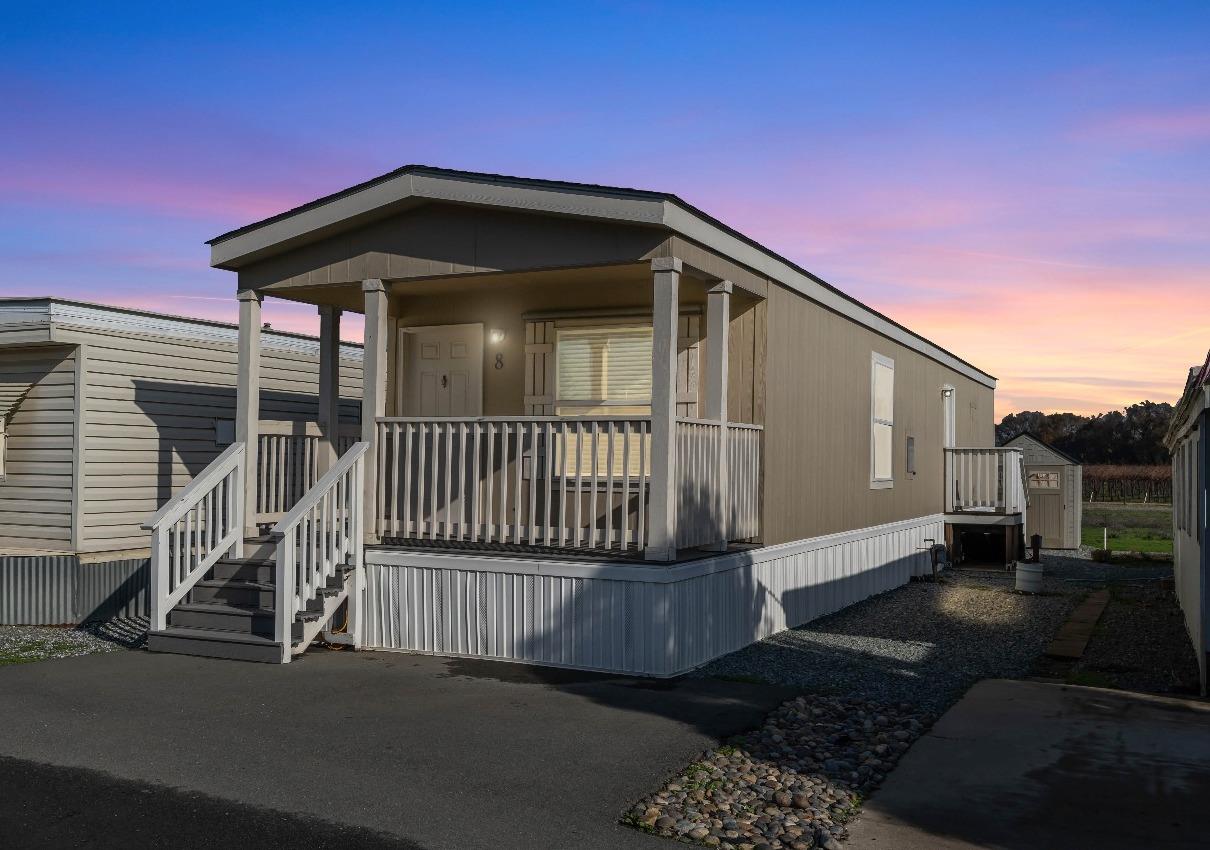 a front view of a house with parking space