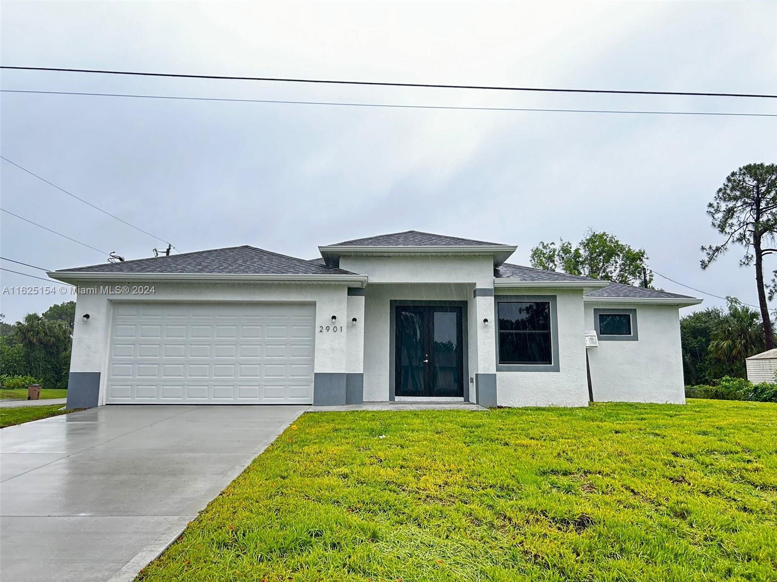 a front view of a house with garage