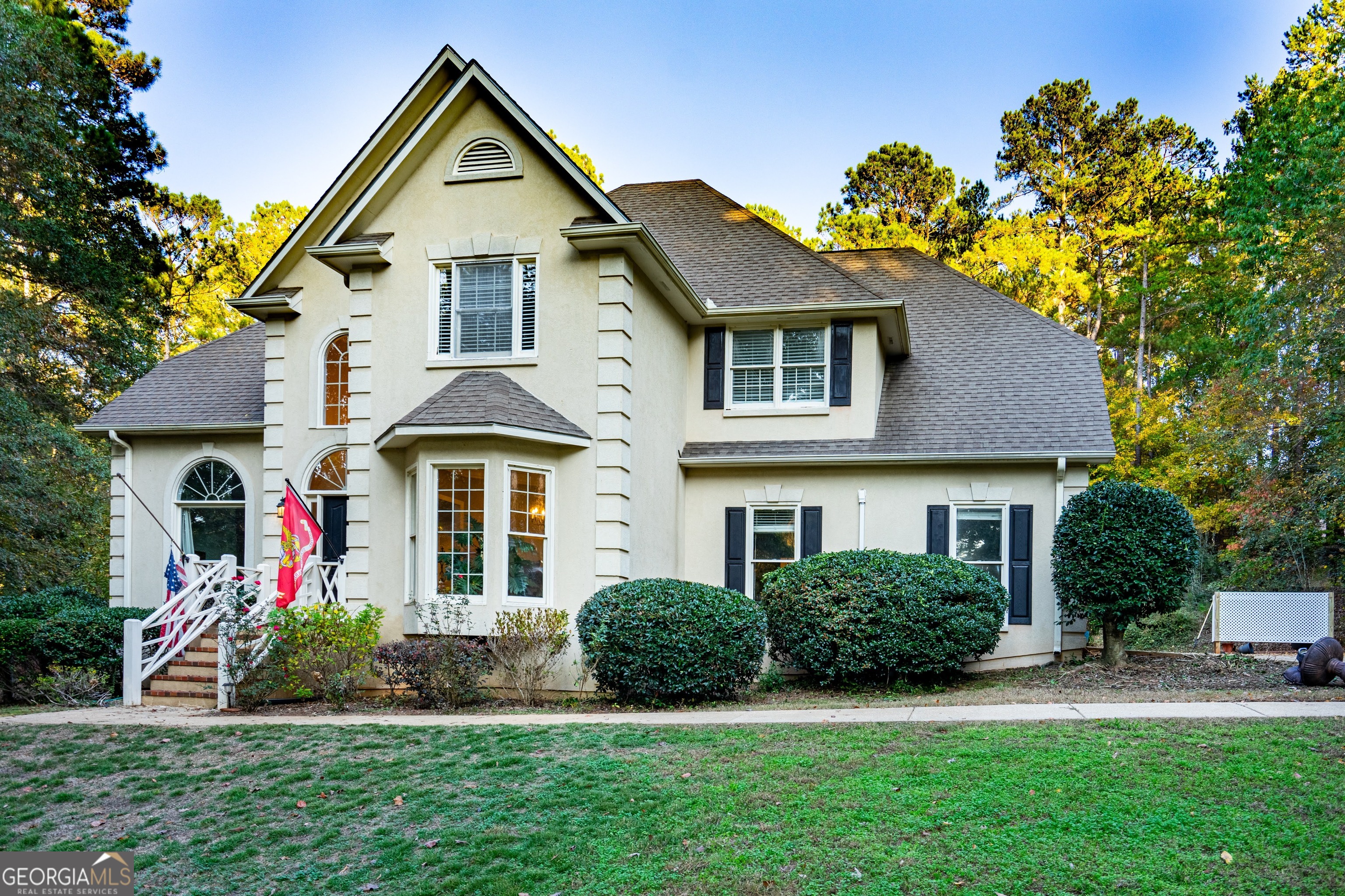 a front view of a house with a yard