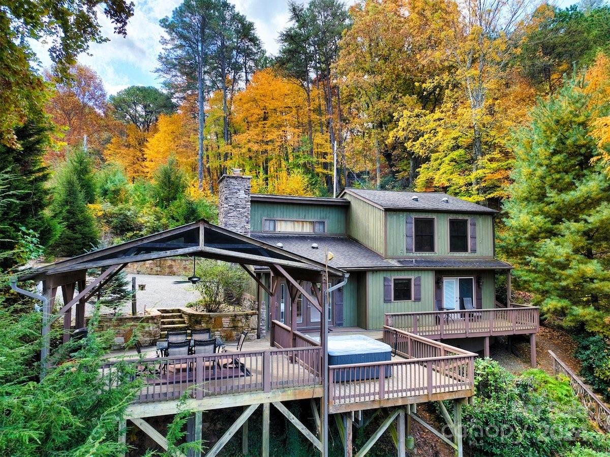 a view of house with roof deck and seating space