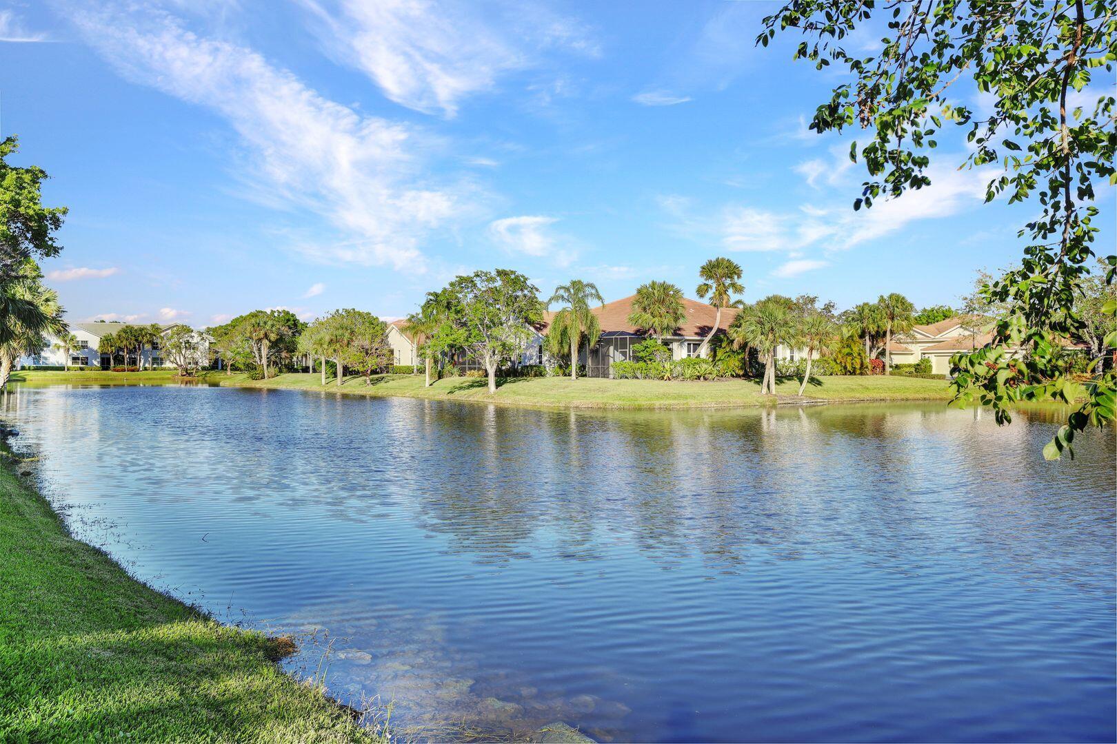 a view of a lake with houses in the background