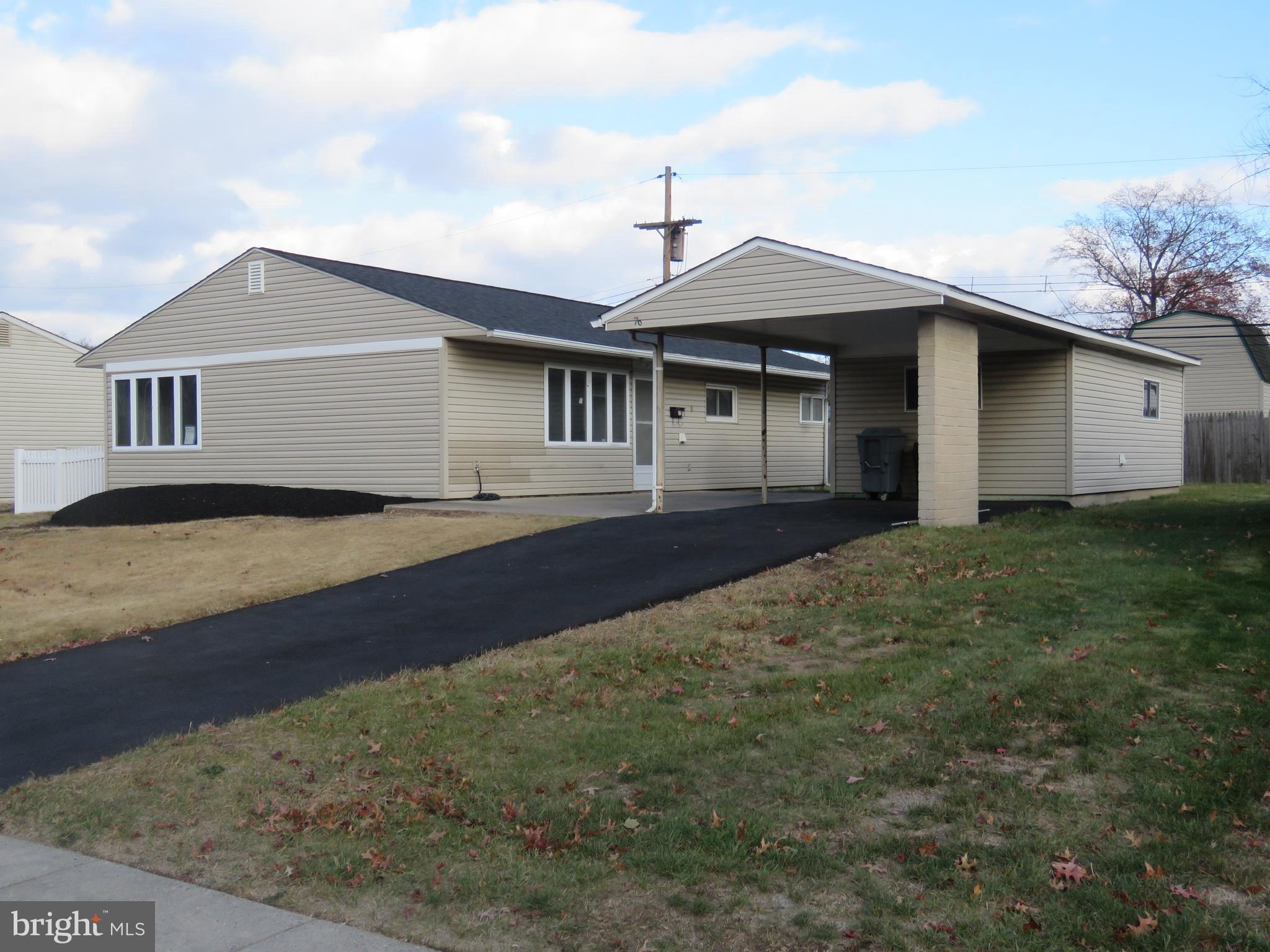 a front view of a house with yard