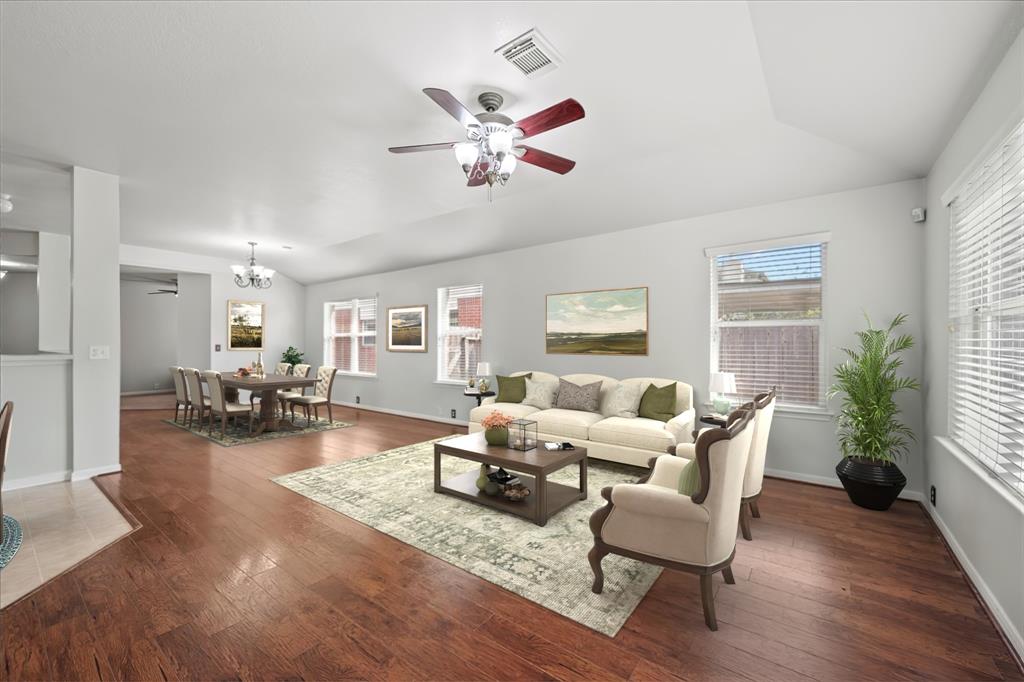 a living room with furniture and a large window