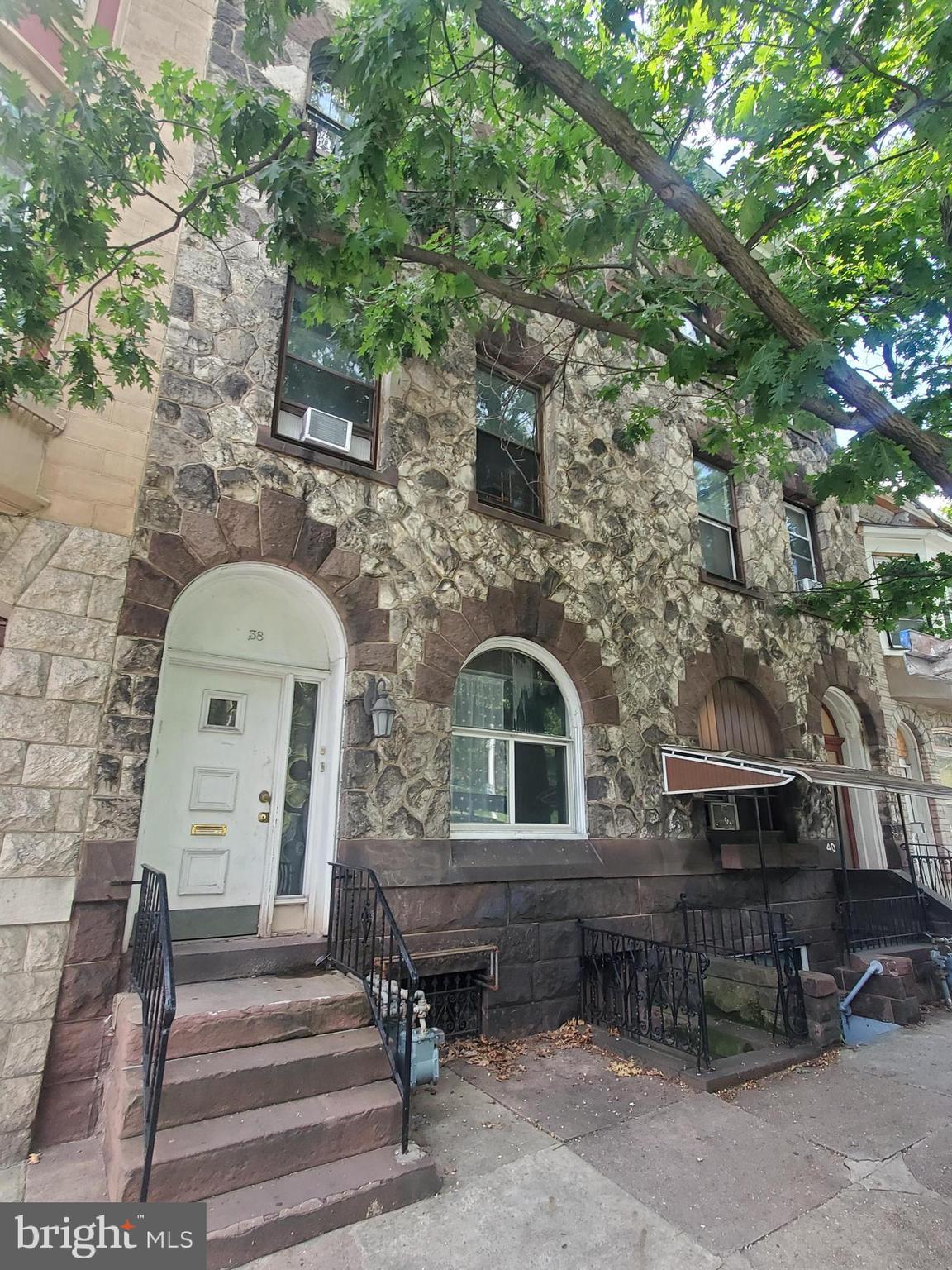 a front view of a house with parking