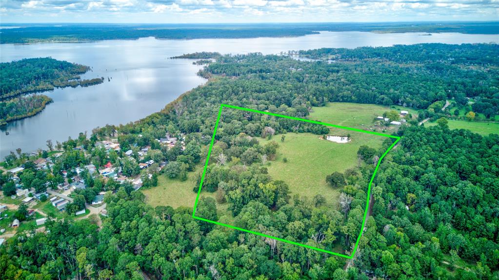 a view of a lake with a yard