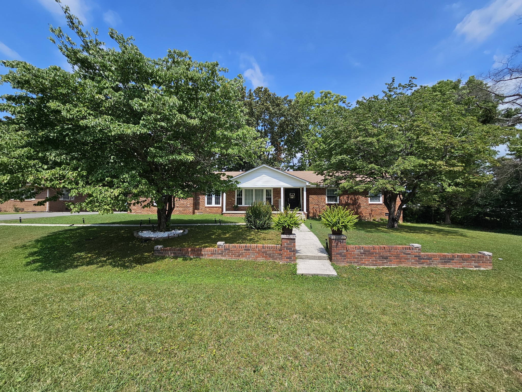 a view of a house with a yard porch and sitting area