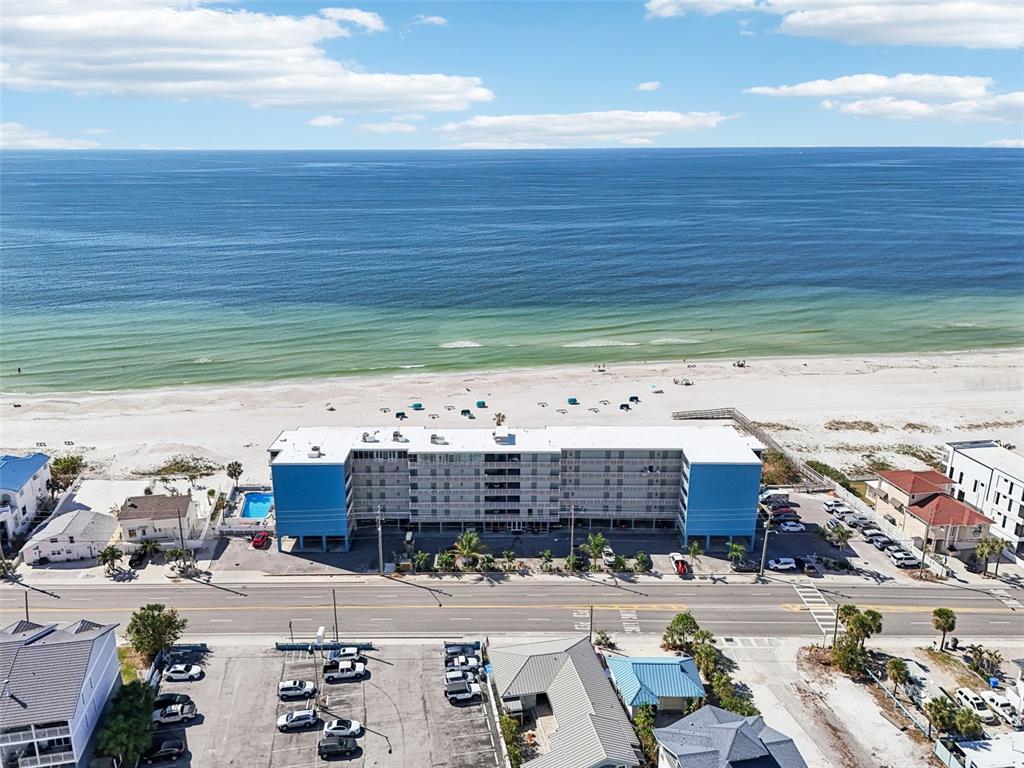 an aerial view of a building with outdoor space