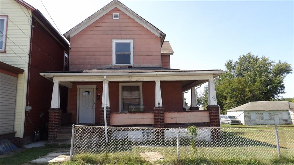 a front view of a house with garage