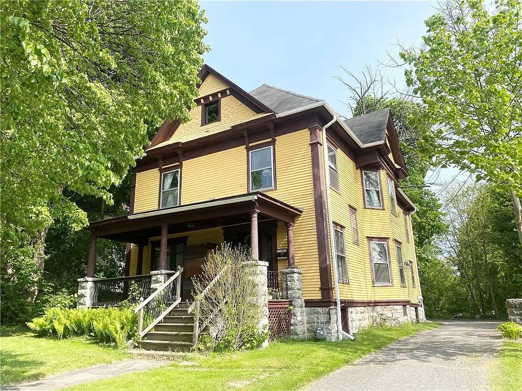 a front view of a house with garden