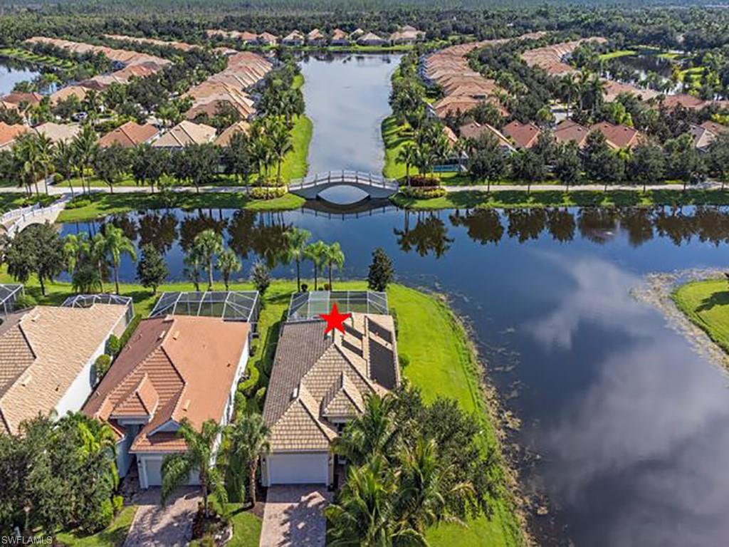 an aerial view of house with a swimming pool yard and outdoor seating