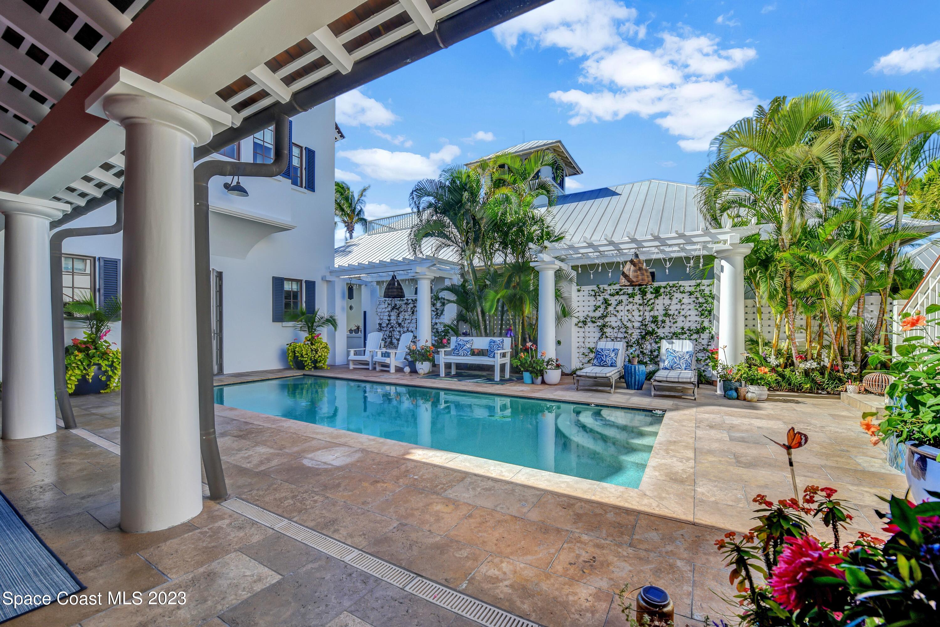 a view of a house with fountain bath tub and chairs