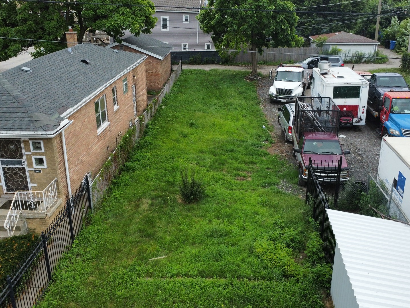 a aerial view of a house with table and chairs