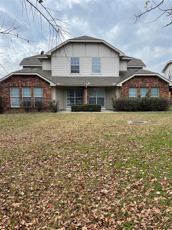 a front view of a house with yard