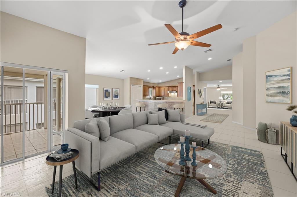 a living room with furniture a rug and a chandelier