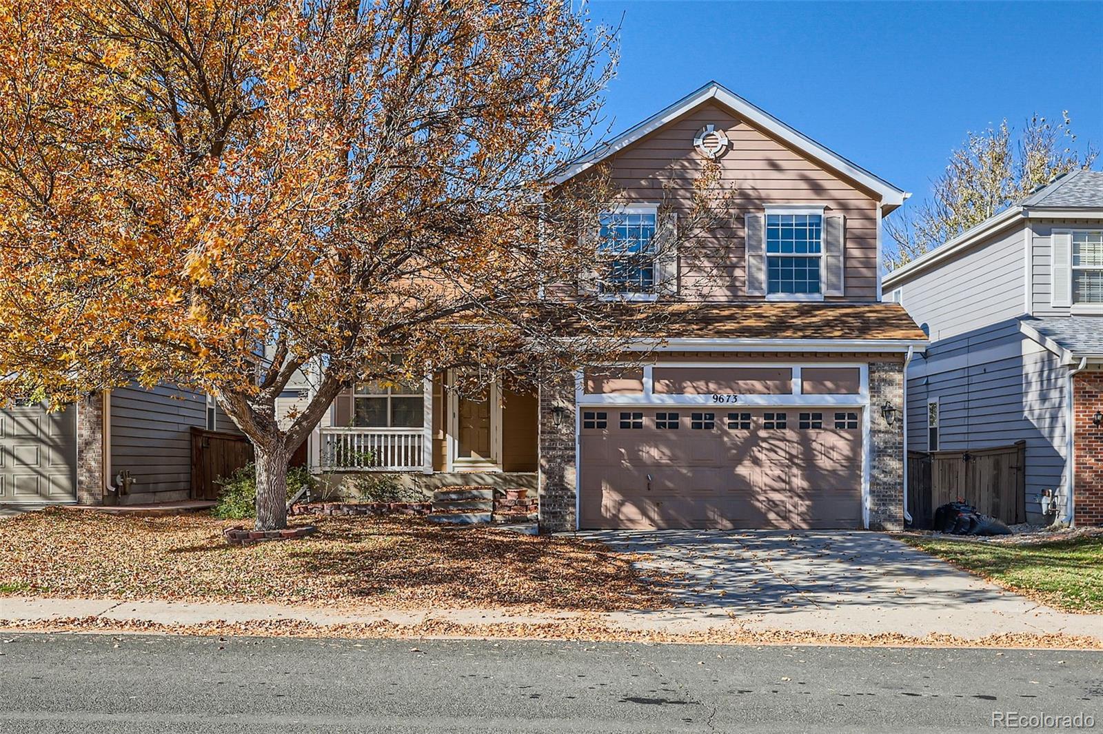 a front view of a house with garage