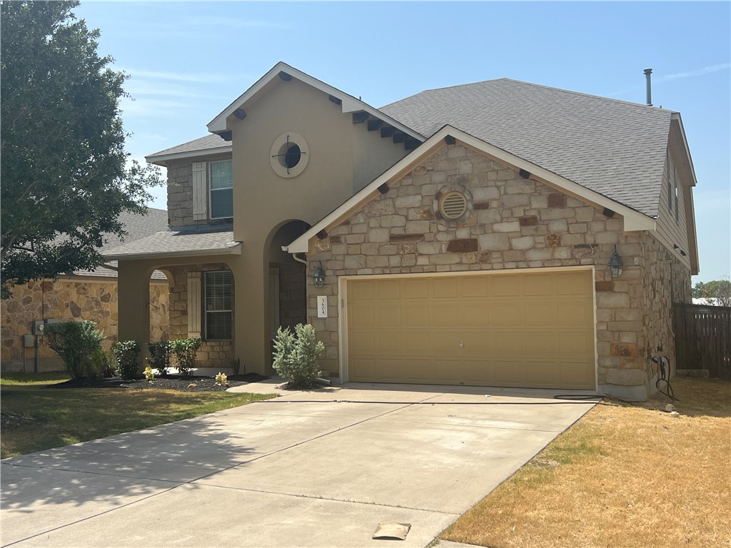 a front view of a house with yard