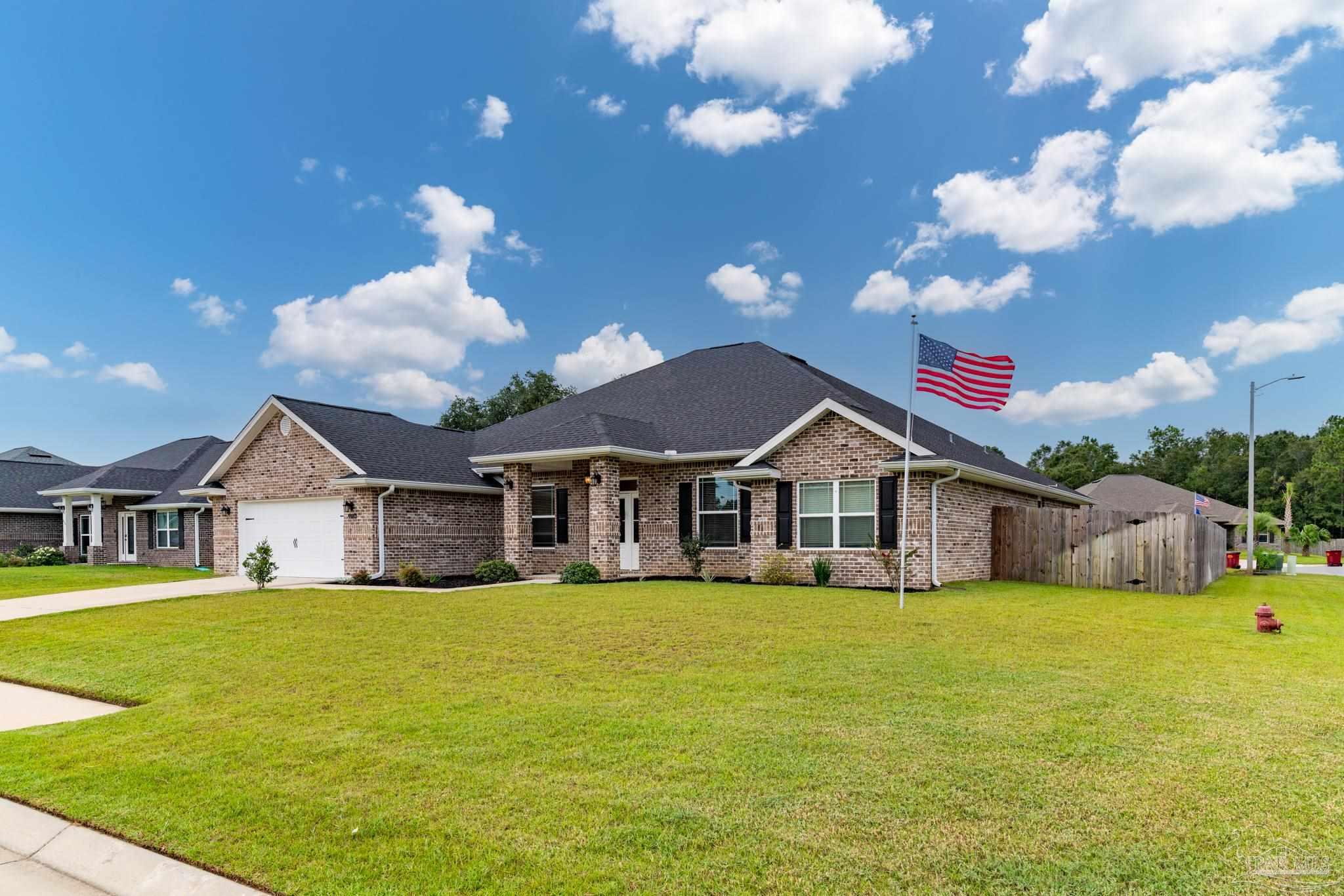 a view of a house with a big yard