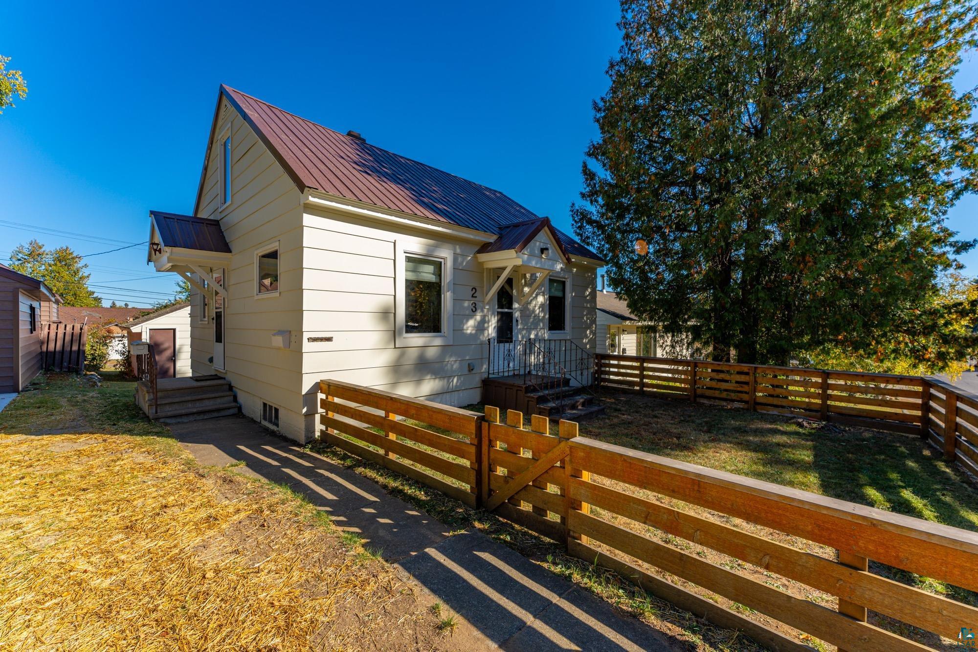 Bungalow-style home featuring a front yard