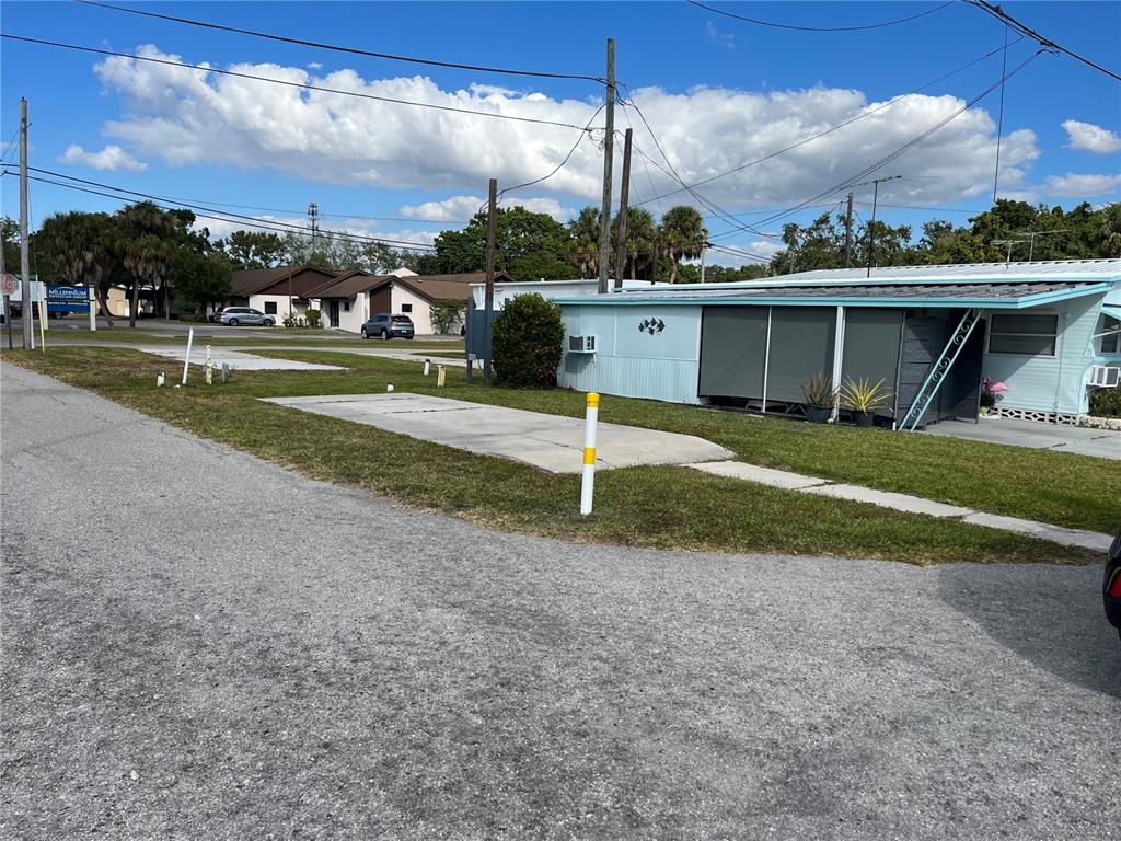 a view of a table and chairs in the middle of a yard